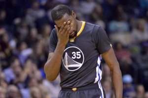 Golden State Warriors forward Kevin Durant (35) reacts on the court between plays in the second half of an NBA basketball game against the Memphis Grizzlies, Saturday, Dec. 10, 2016, in Memphis, Tenn. (AP Photo/Brandon Dill)